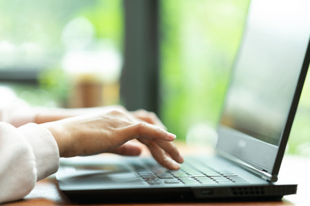 close up Woman in cafe shopping online with laptop