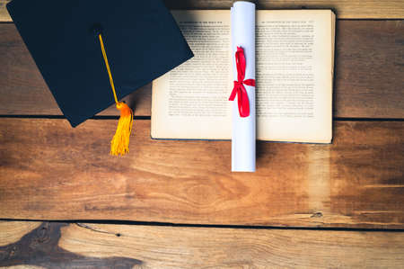 Portrait Young Asian woman university graduates celebrate degree certificate in commencement ceremony. Congratulations, graduation, education.の写真素材