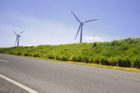 Wind power station - wind turbine against the blue skyの写真素材
