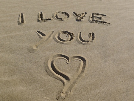 Summer love concept with I love you sign and heart shape on the beach の写真素材