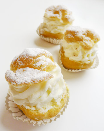 Closeup of delicious Italian handmade mini cake dessert with whipped cream 