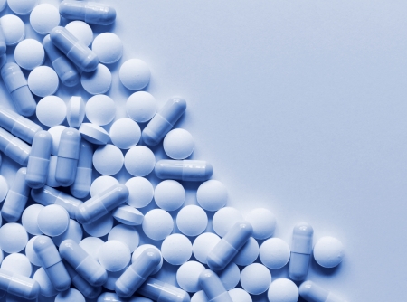 Pharmaceutical pills scattered on table, background with copyspace の写真素材