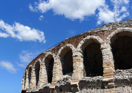 Side view of arches and details of famous ancient roman amphitheatre Arena di Verona in a sunny day with blue sky, Italy, Europe の写真素材