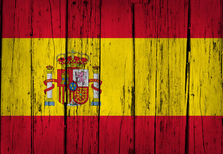Spain grunge wood background with Spanish flag painted on aged wooden wall の写真素材