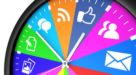 Social media time management and web strategy concept with a clock and social network icon printed...