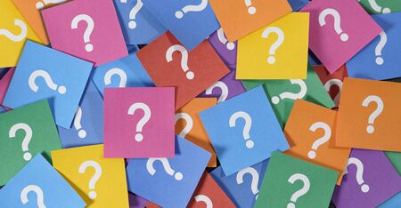 Question mark symbol and sign on many colorful note papers, customer questions and business faq assistance concept top view background.の写真素材