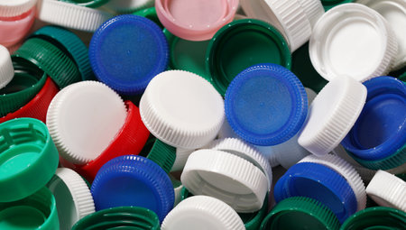 Plastic bottles caps close up recycling and reuse concept background.の写真素材