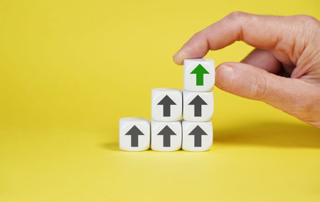 White cubes growing graph arranged in upward sequence with arrows icon pointing up symbolizing...