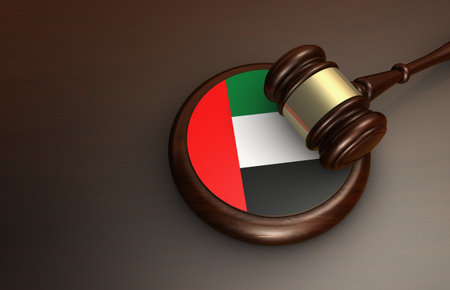 United Arab Emirates law, legal system and justice concept with a gavel and the UAE flag on a wooden desk 3D illustration.の写真素材