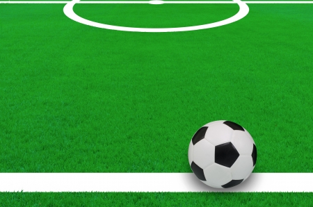 soccer ball on the green grass fieldの写真素材