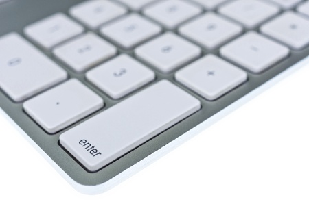 Modern aluminum computer keyboard isolated on white backgroundの写真素材