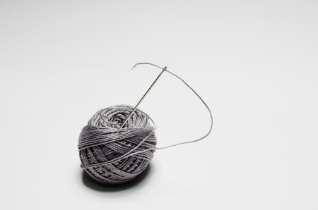 Gray ball of yarn for knitting isolated on white backgroundの写真素材