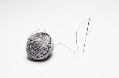 Gray ball of yarn for knitting isolated on white backgroundの写真素材