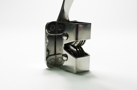 Sharpening the kitchen knives. Isolated on a white background.の写真素材