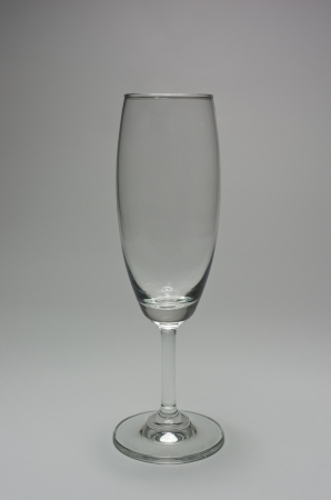 The glass is placed on a gray background の写真素材