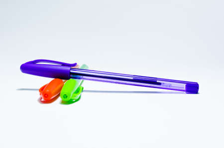 Pens, purple, green and orange  Isolated on a white background の写真素材