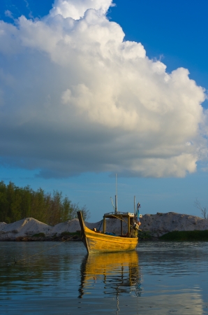 Fishing boat for yellow fish at the The beach. Under a beautiful blue sky.の写真素材