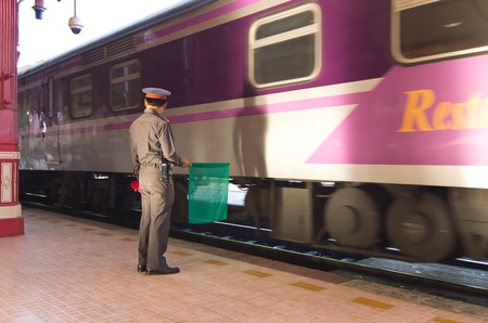 Station officials held the green flag to signal to them の写真素材