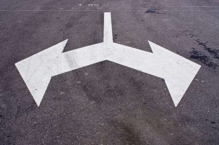White arrows on the road  That is separate の写真素材