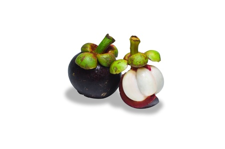 tropical mangosteen fruit on white background (selective focus on front piece)の写真素材
