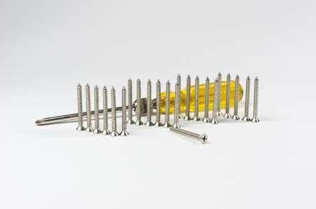 Screwdriver handle of yellow and Screw. Isolated on white.の写真素材