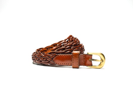 The beautiful brown leather belt on a white background の写真素材