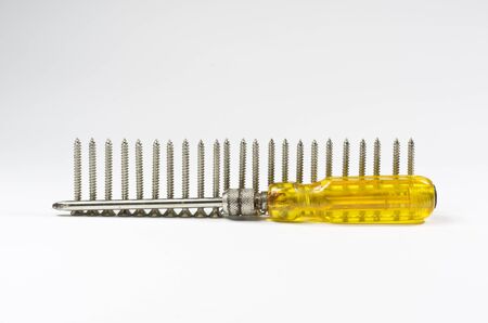 Screwdriver handle of yellow and Screw  Isolated on white の写真素材
