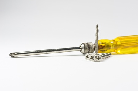 Screwdriver handle of yellow and Screw  Isolated on white の写真素材