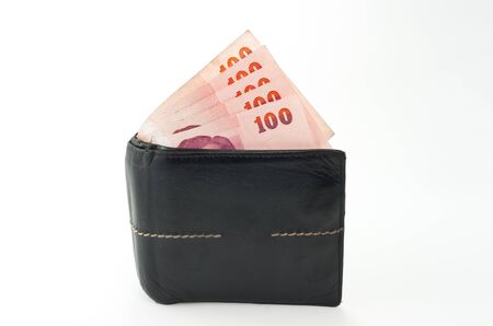 black leather wallet with money isolated on white backgroundの写真素材