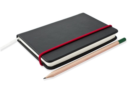 Small black notebook with blank cover. Isolated on white.の写真素材
