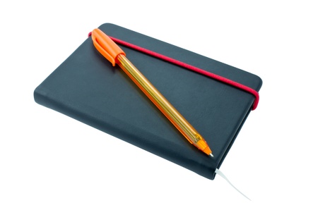 Small black notebook with blank cover. Isolated on white.の写真素材