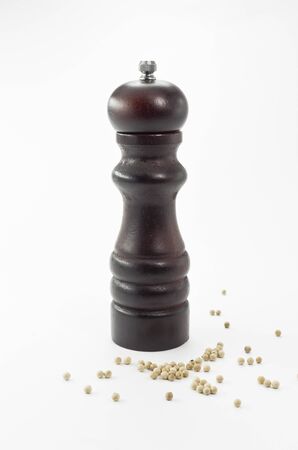 A Wooden pepper grinder isolated on white backgroundの写真素材