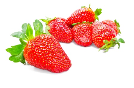 Red strawberry fruits with green leaves isolated on white backgroundの写真素材