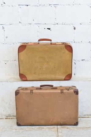Vintage brown suitcase isolated over white backgroundの写真素材