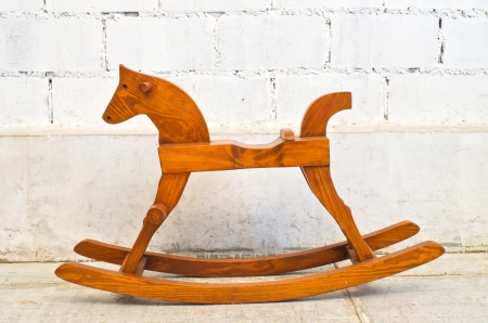 wooden rocking horse chair children isolated on white backgroundの写真素材