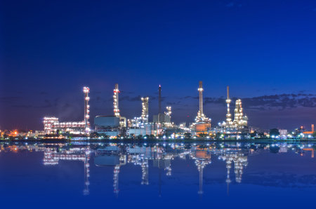 Oil refinery factory at Twilight. Chao Phraya river in Bangkok, Thailand.