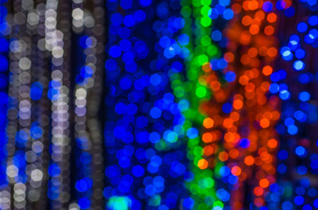 Abstract decorated in Christmas lights at night.