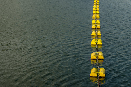 Yellow buoys mark the entrance to the dam