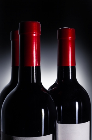 Bottle of red wine on the black background.の写真素材