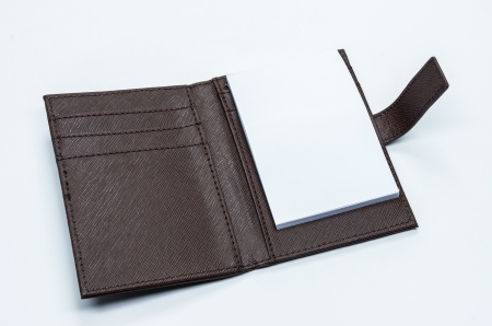 Note book is made of brown leather cover on a white background.の写真素材