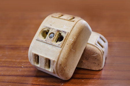Old ancient power outlet on wooden floor