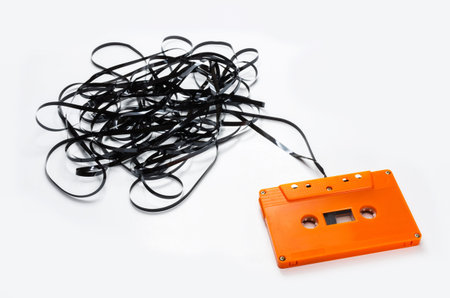 Vintage Orange audio Cassette isolated on white.の写真素材