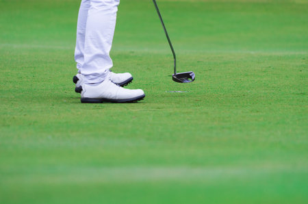 Golf stance while preparing to shoot  At the teeing ground