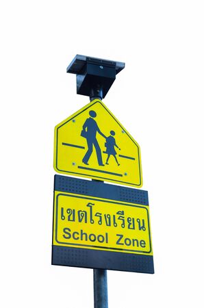 School zone sign isolated on white. Use of solar energy.の写真素材