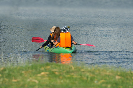 Visitors are ferried the kayak on the lake.