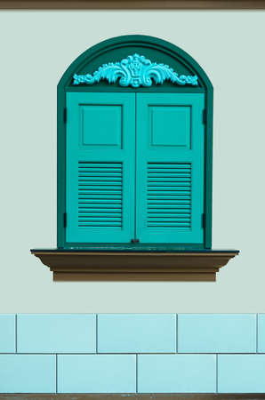 Window antique green. The pale yellow walls.の写真素材