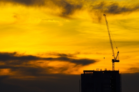 Silhouette crane construction industry and building work.の写真素材
