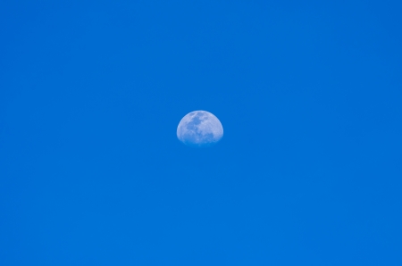 Beautiful sky blue background with a white moon.の写真素材