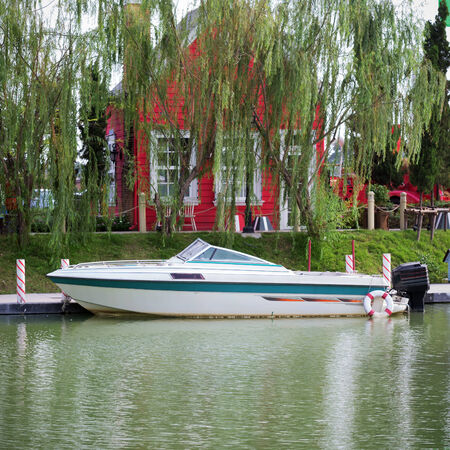 White motor boat on the lake at a standstill.の写真素材