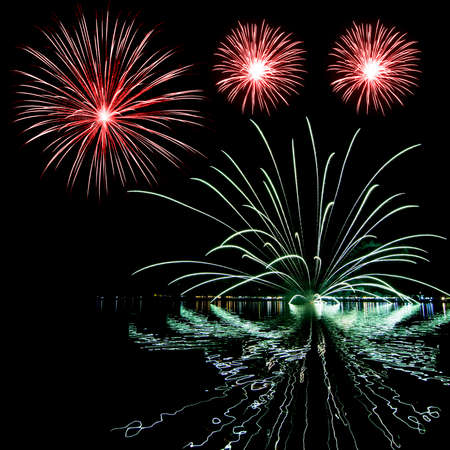 Fireworks of many exposures collage in a black background の写真素材